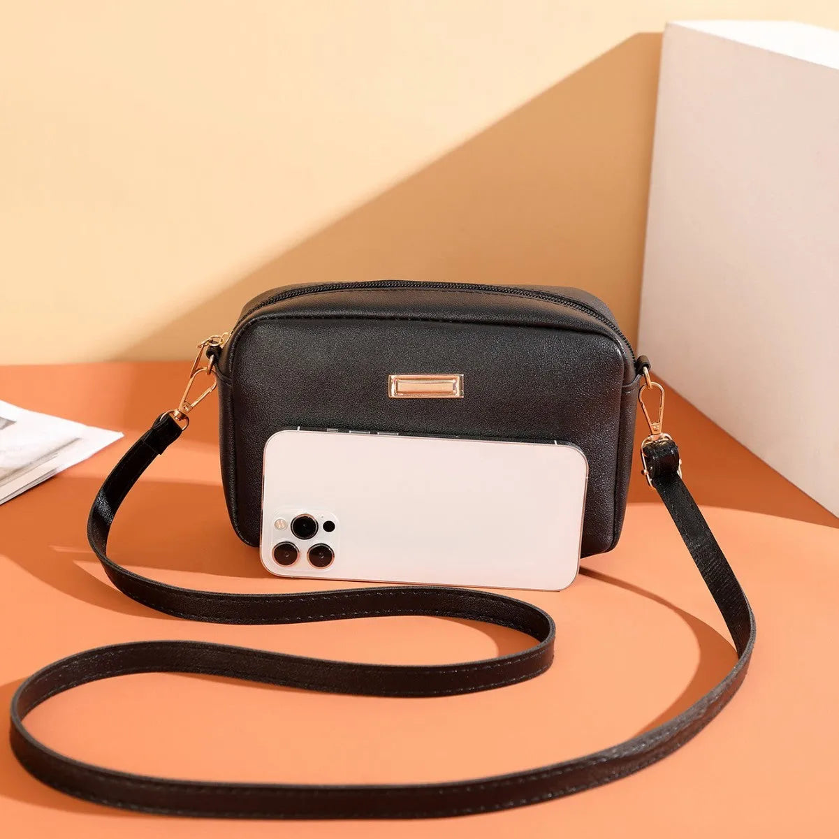 Women's solid colour PU shoulder bag with a three-dimensional pocket and horizontal square shape.