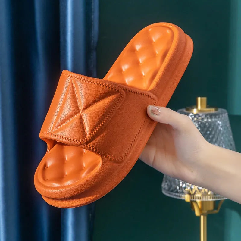 A pair of soft EVA bathroom slippers with a thick non-slip sole, shown in available colours.