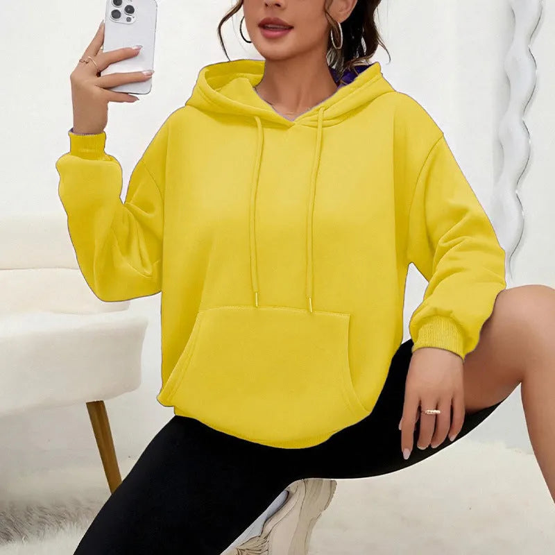 Women's loose drawstring pocket sweatshirt in various colours showing front pockets and adjustable collar