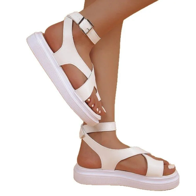 Women's white thick-soled Roman lace buckle sandals on a neutral background