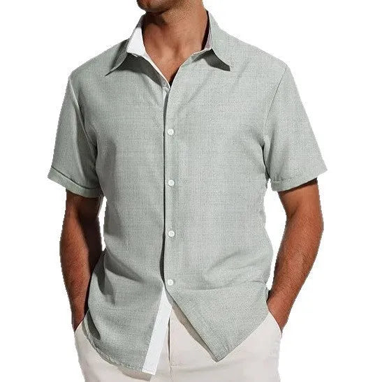 Man wearing a short sleeve floral print shirt in cardigan style, suitable for summer.