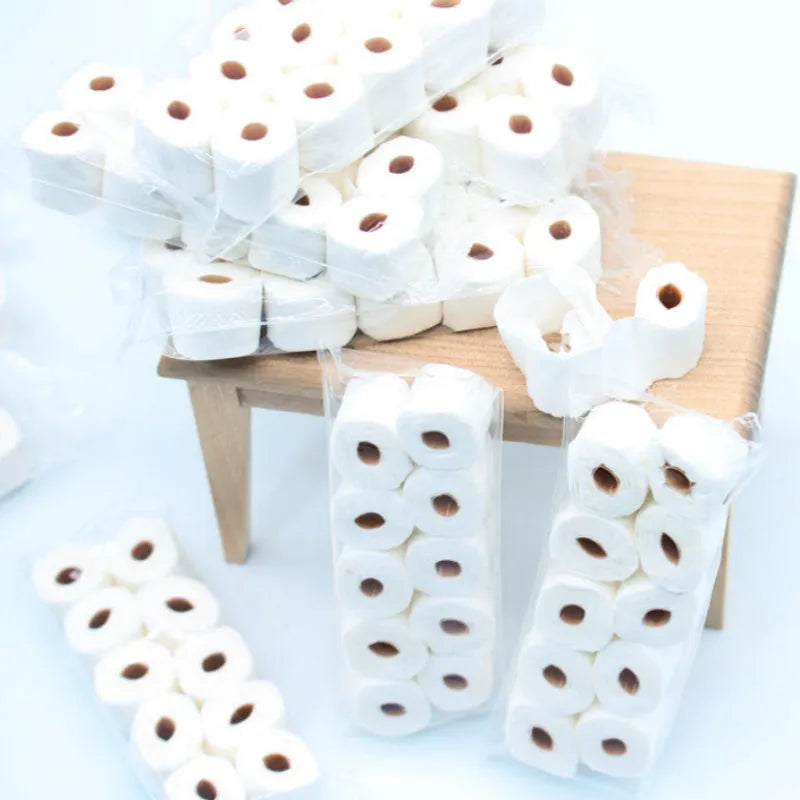 Miniature paper model of a tissue roll toy for children, dimensions 30mm by 15mm by 80mm.