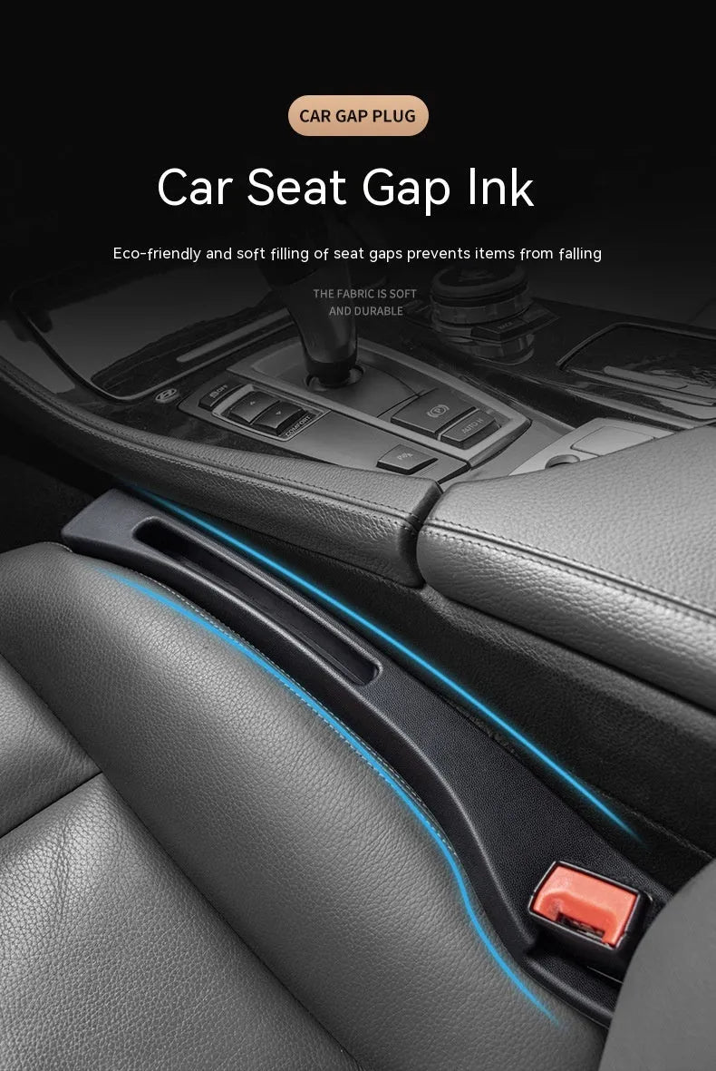 Black plastic car seat gap storage organiser box with handle inserted between car seat and centre console.