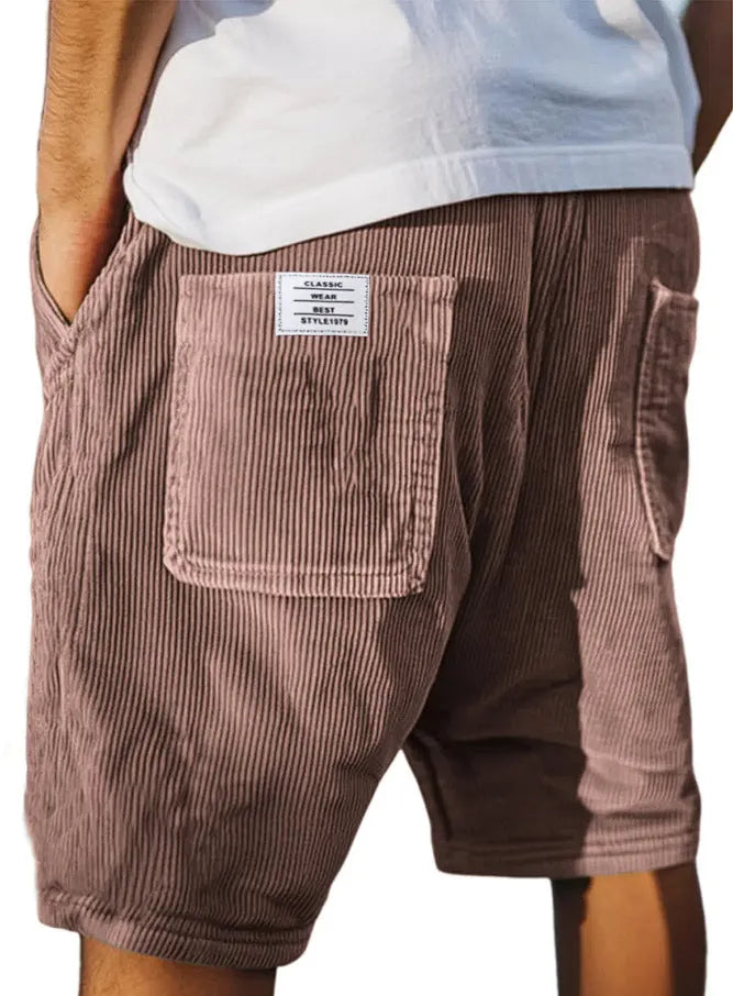 Men's grey straight-fit corduroy shorts with multiple pockets and a small embroidered logo on the leg.
