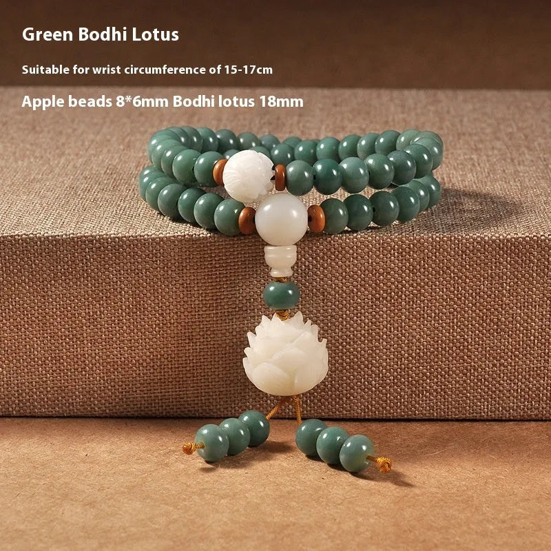 White jade and green sandalwood Bodhi seed bracelet showing either the safety buckle or lotus clasp fastening.