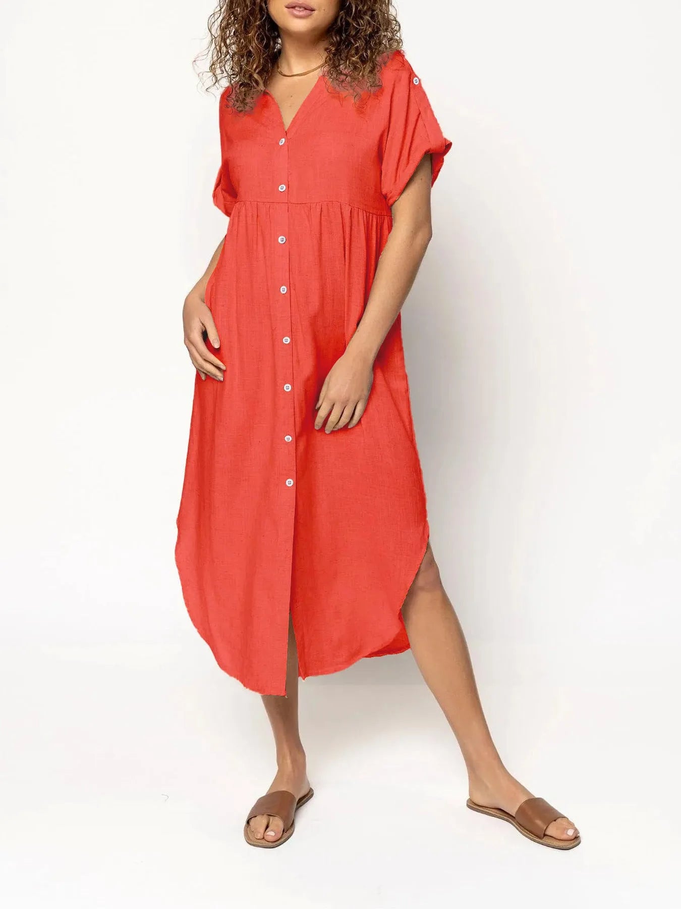 Loose-fitting casual solid colour button dress in a mid-length style on a hanger.