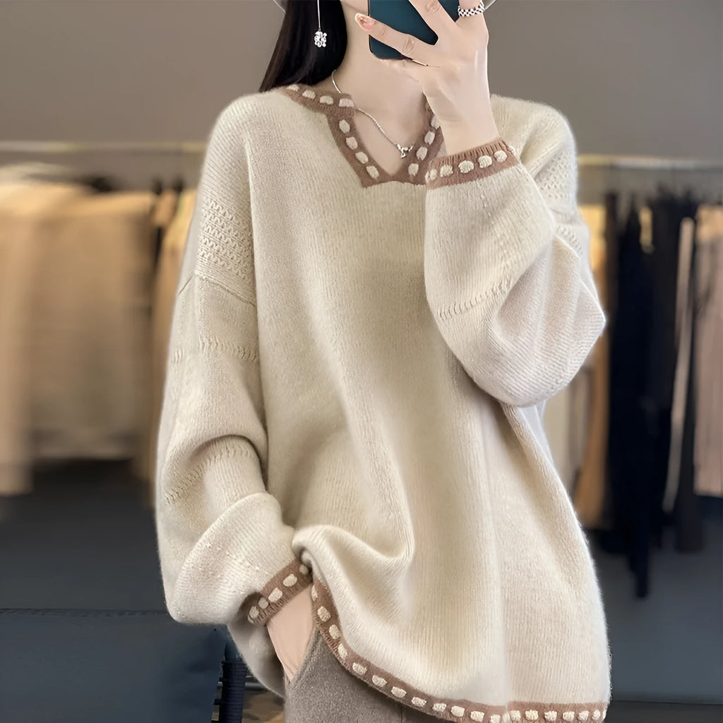 Women's V-neck pullover sweater in camel colour showing regular long sleeves and pullover construction
