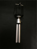 Black and silver desktop phone holder with a two-section adjustable bracket on a wooden desk.