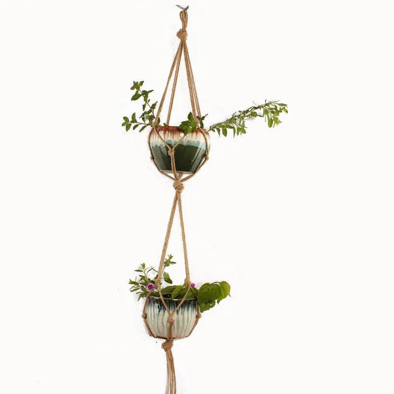 Woven cotton rope plant pot holder for wall mounting or desktop plant display.