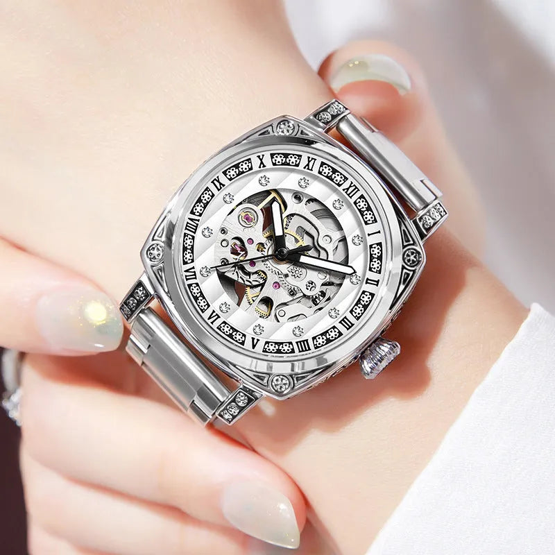Mechanical wristwatch with luminous hands on a leather strap, shown in multiple colour options.