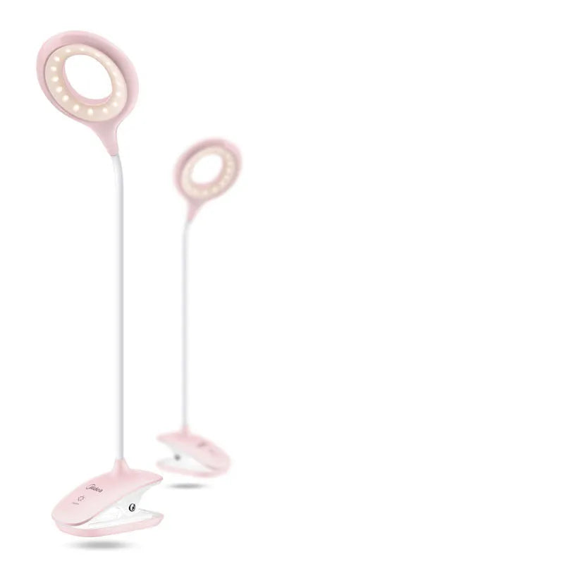 Green, pink and white USB rechargeable touch control table lamps on a wooden surface