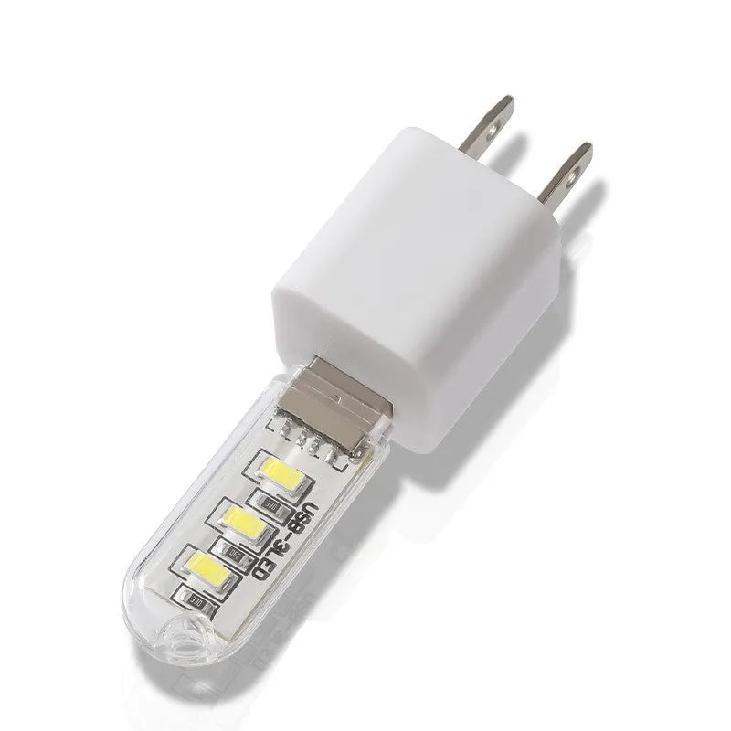 Small round USB baby night light showing warm and white light colour options