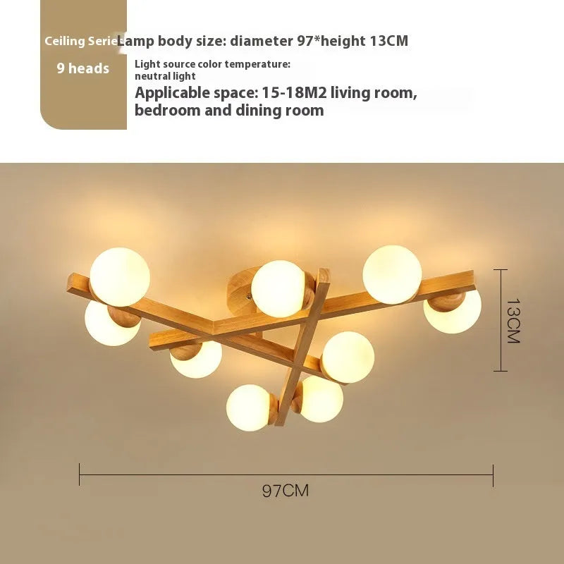 Modern wooden finish ceiling light with three adjustable lamp heads in a neutral white colour.