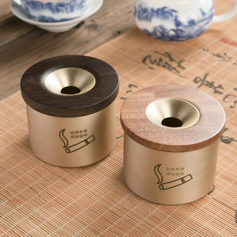 Brass ashtray with wooden lid in retro design for living room decor