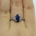 Women's geometric hollow ring in silver electroplated alloy with zircon detail showing open-work pattern