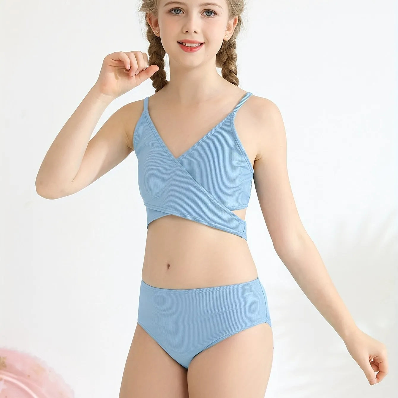 Girls two-piece criss-cross swimsuit set in blue green with polypropylene fabric