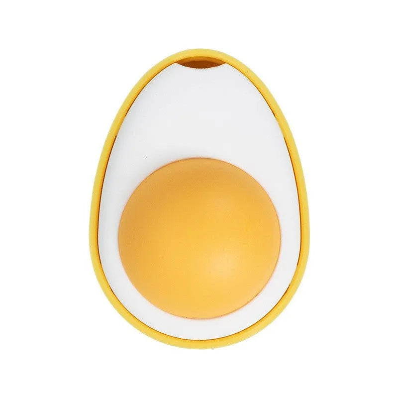 Soft plush catnip ball toy in egg shapes stuck to a wall for interactive cat play.