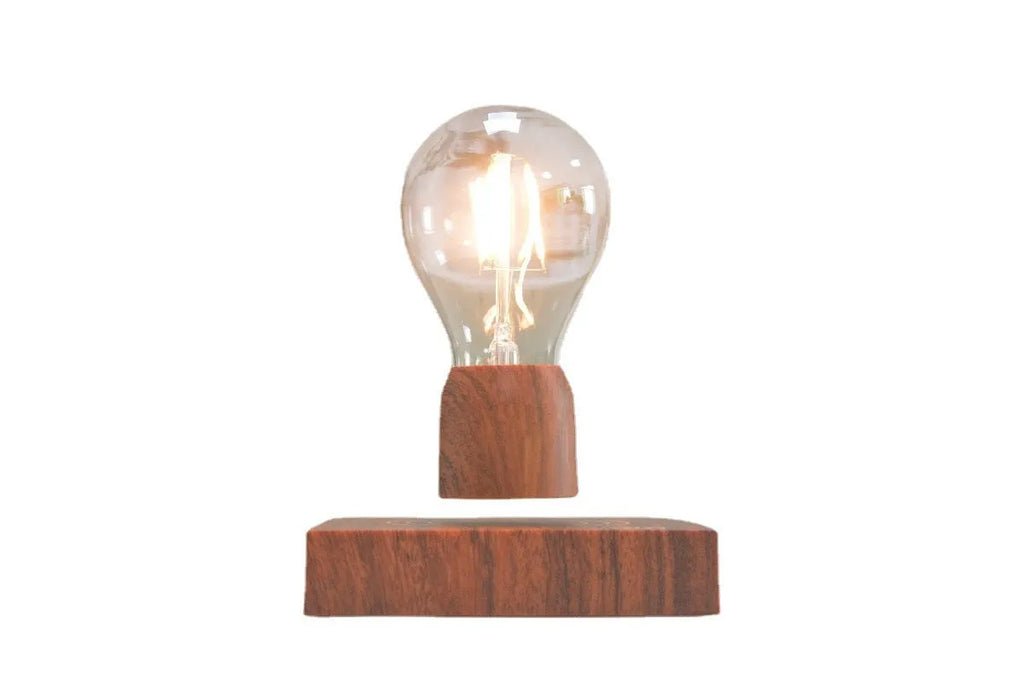 Magnetic levitation floating bulb lamp with imitation wood base and glass construction