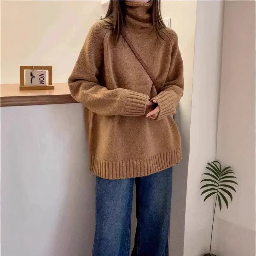 Women's thick loose turtleneck sweater in black with curling pile collar and 3D pattern