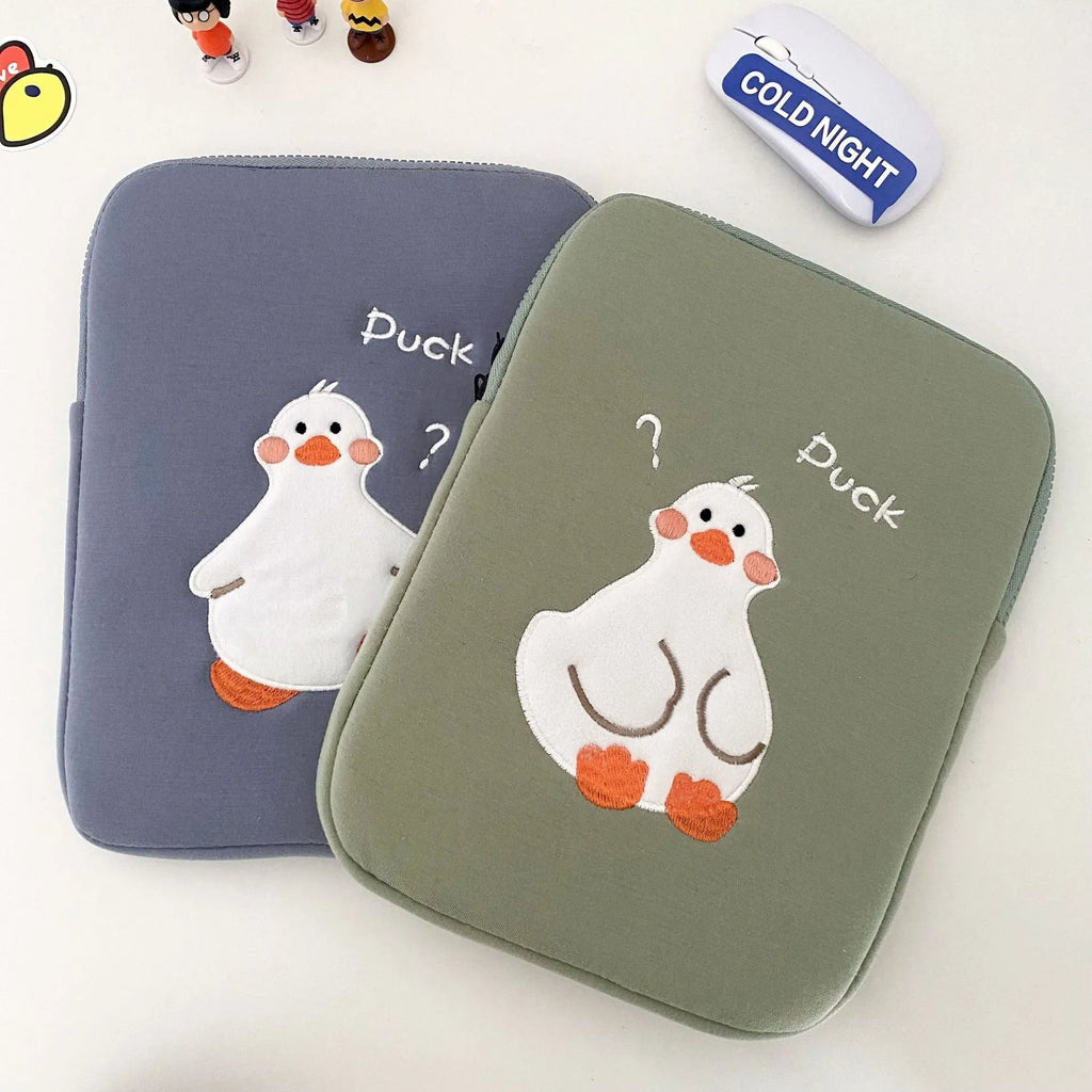 Blue cotton tablet case with embroidered cartoon duck design, zipper closed.