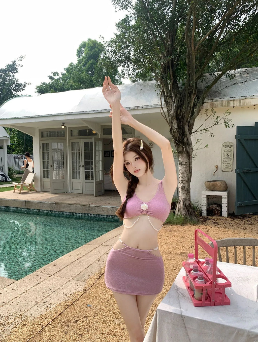 Bear Vacation brand three-piece bikini swimsuit for women in pink or black, showing briefs and sleeveless top.