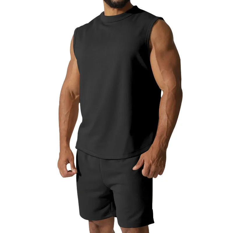 Men's sleeveless cotton blend sports suit showing sleeveless top and matching shorts in a solid colour.