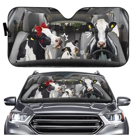 Telescopic aluminium foil car sun visor extended across a vehicle windshield