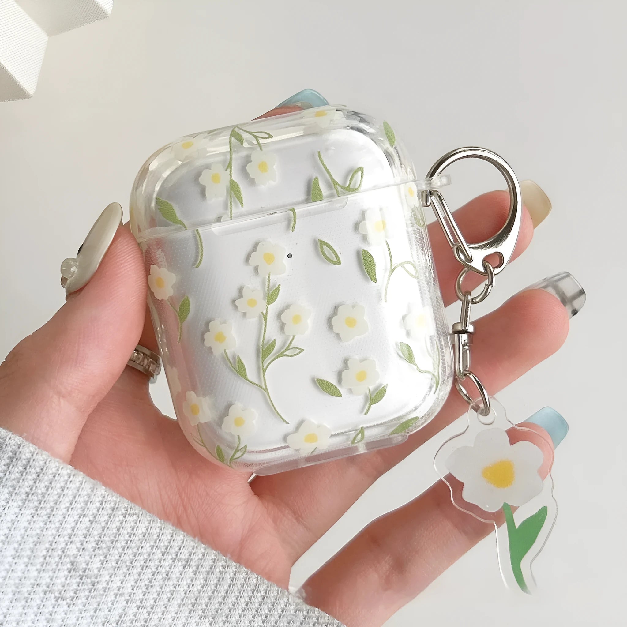 White floral transparent TPU protective case for Apple AirPods showing floral pattern details