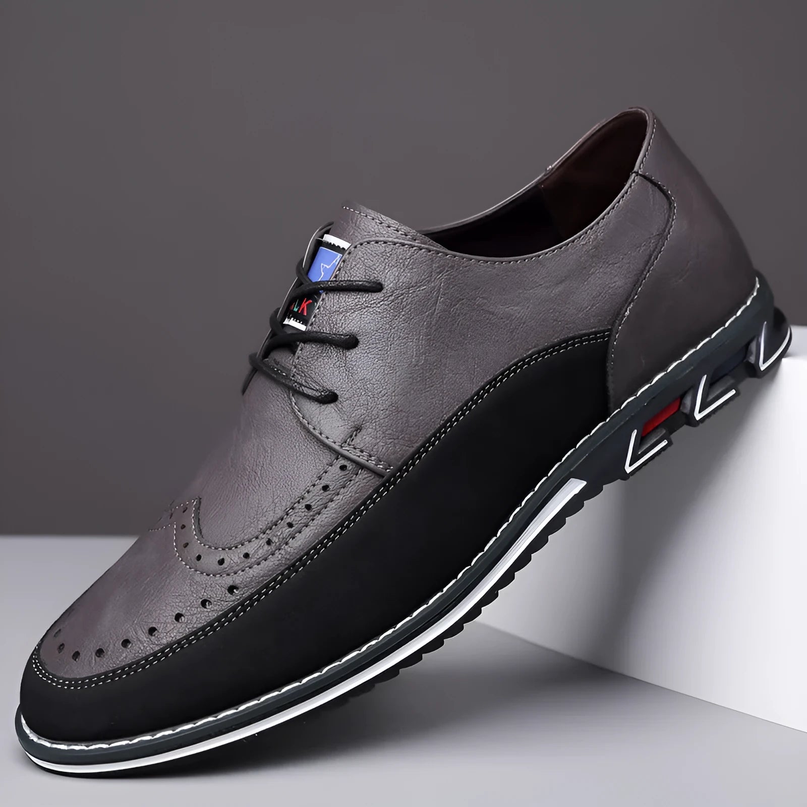 Men's casual low-top leather shoes with a fabric upper, leather toe cap, and rubber sole.