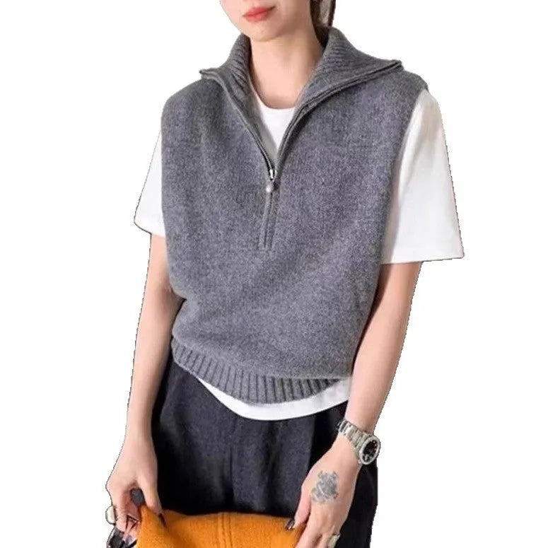 Orange retro half zip sleeveless mesh knit vest with 3D pattern showing front view