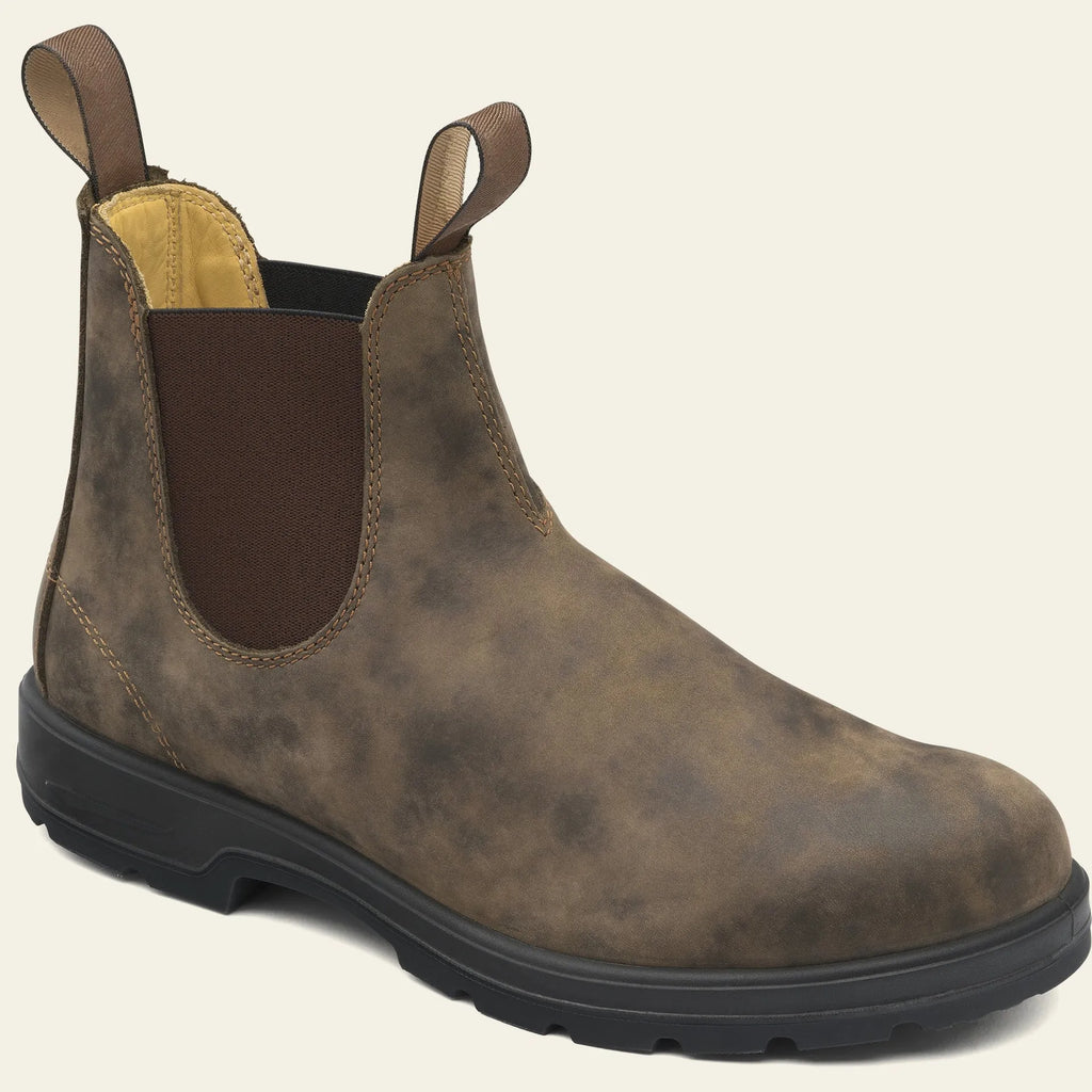 Vintage frosted brown PU leather Chelsea boots for men and women on a wooden surface.