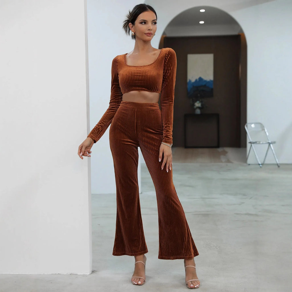 Caramel coloured women's long sleeve sweater and loose trouser co-ord set on a hanger
