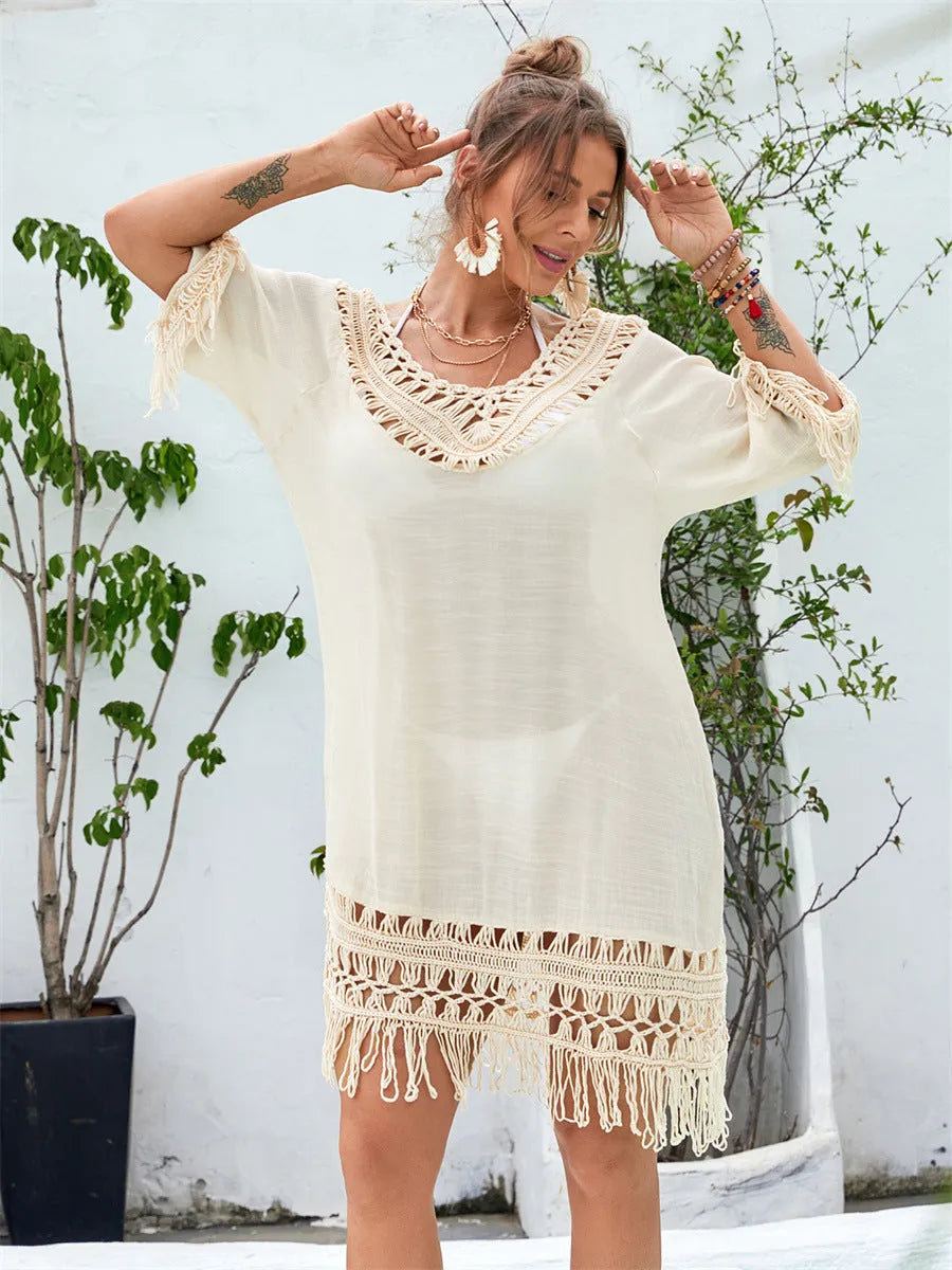 Apricot hand-crocheted long beach dress for women on a beach