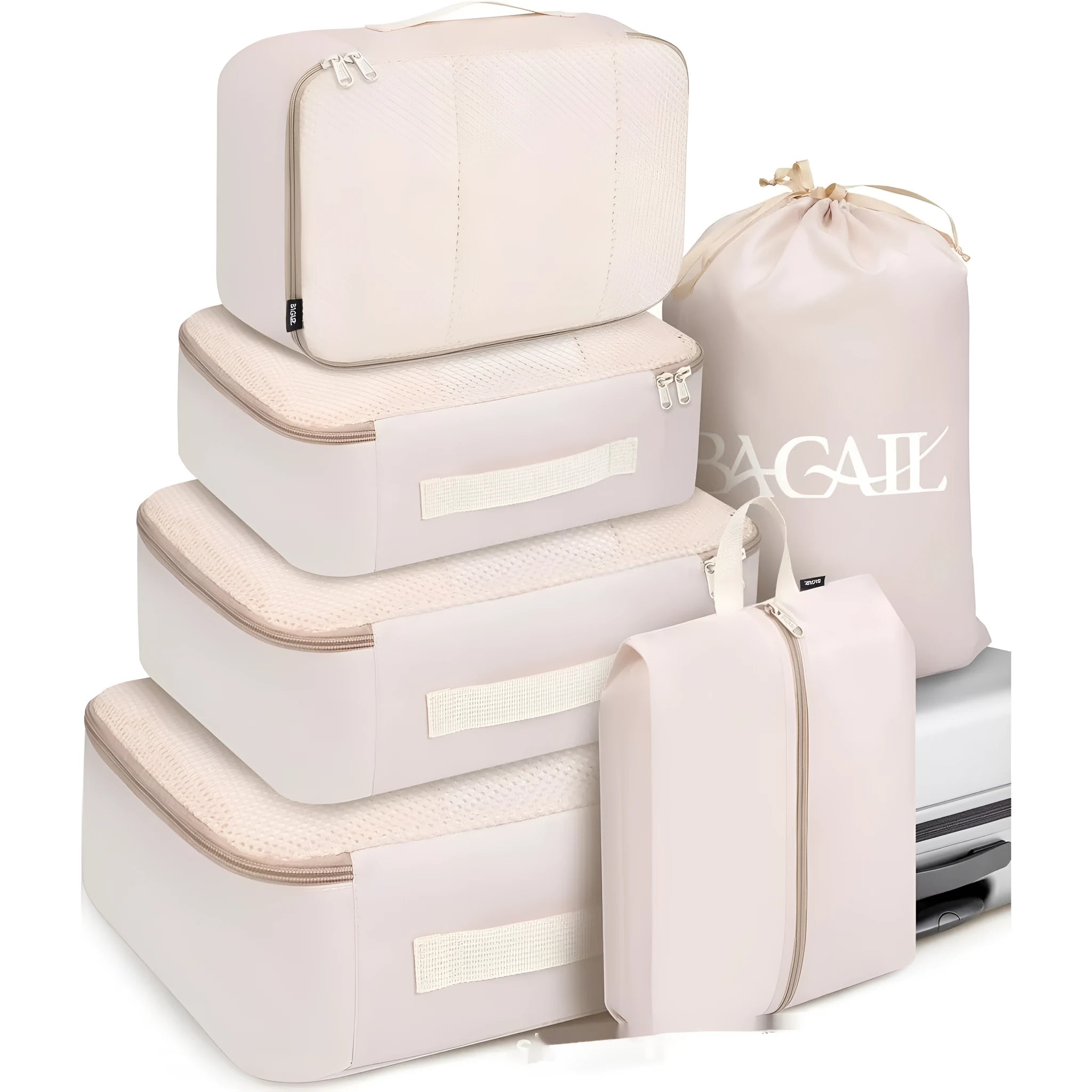 Eight cubic travel packing bags in various colours including beige, black, pink leopard print, and white pink stripes