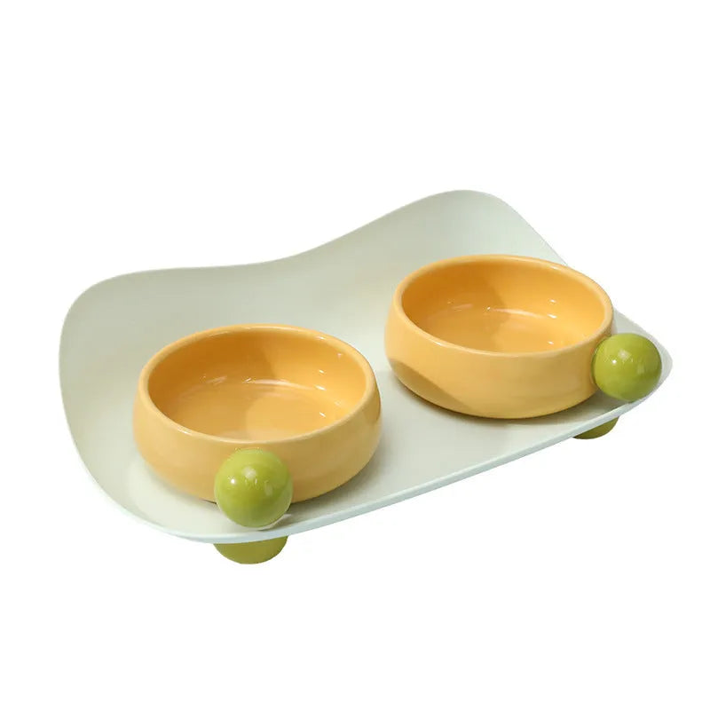 Elevated ceramic double bowl set for pets in pink, yellow or pink yellow with non-slip base