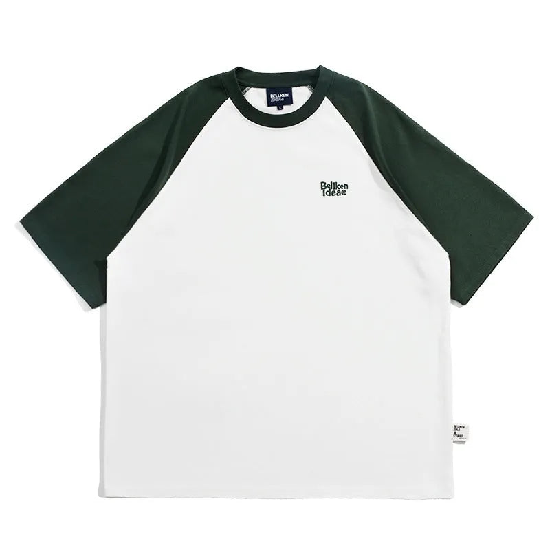 Man wearing a loose blue raglan sleeve casual t-shirt, Japanese style, thin polyester blend.
