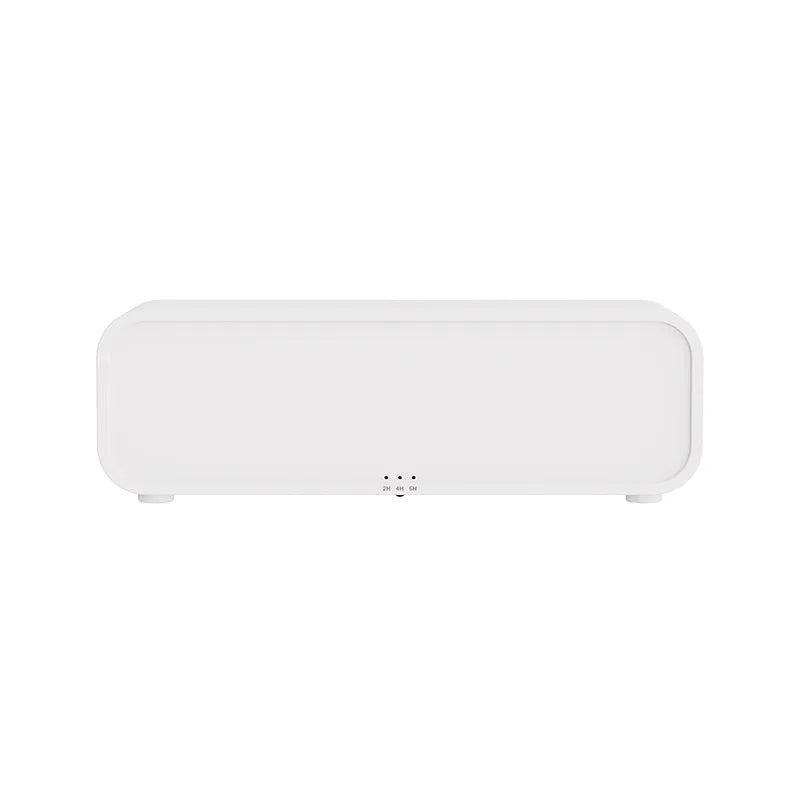 Black and white flame effect aroma diffuser with remote control on a table