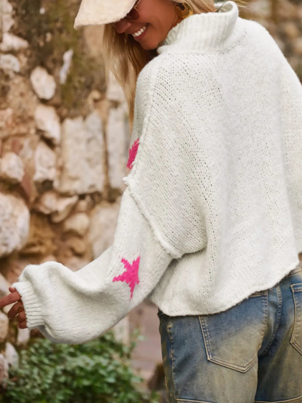 White women's loose turtleneck pullover sweater with five-pointed star pattern and contrast detailing