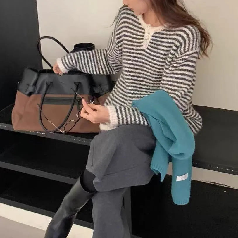 Women's striped cashmere sweater in red and blue colours with plaid pattern and loose fit