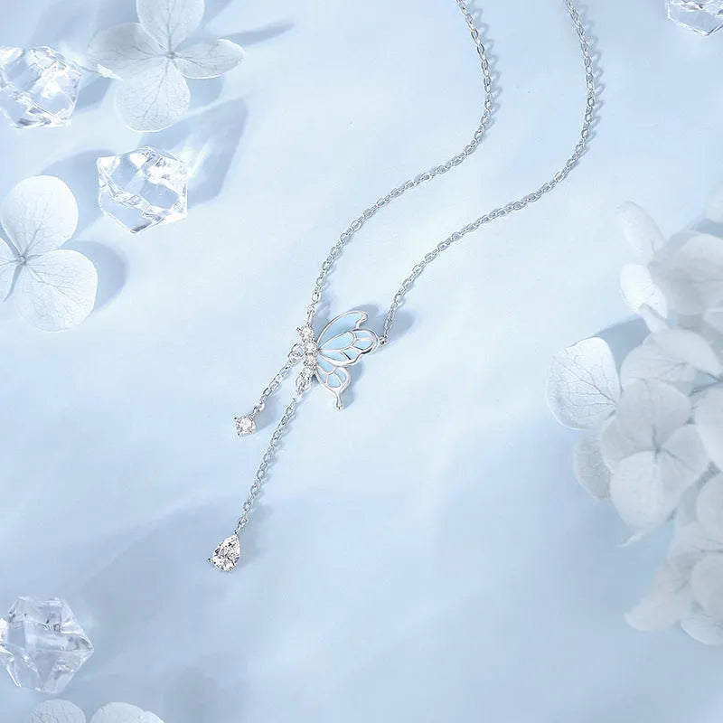 Sterling silver S925 butterfly tassel necklace with noctilucent luminous pendant and adjustable O-ring chain on white background