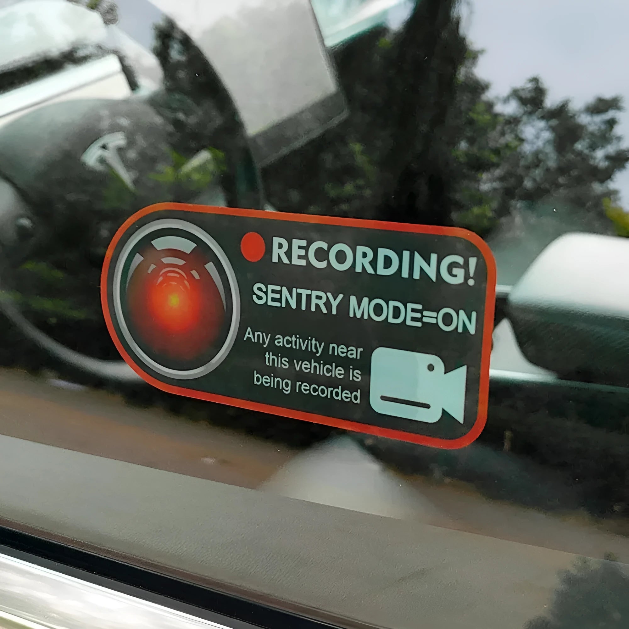 Tesla Sentry Mode electrostatic warning sticker measuring 11 by 5 centimetres