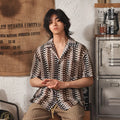 Grey slim fit men's Cuban collar short-sleeve shirt with textured jacquard fabric.