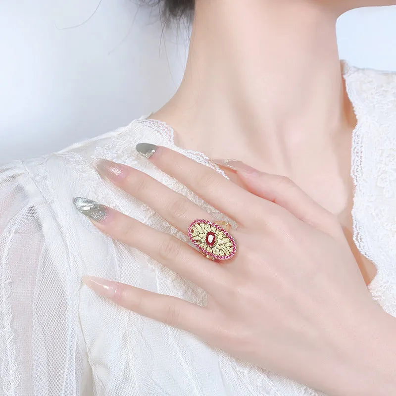 Gold-plated red corundum jewellery set showing necklace, ring and ear studs with diamond-cut water drop design