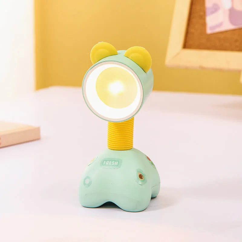 DIY cartoon animal small night lamp with magnetic base in assorted colours on a desk.