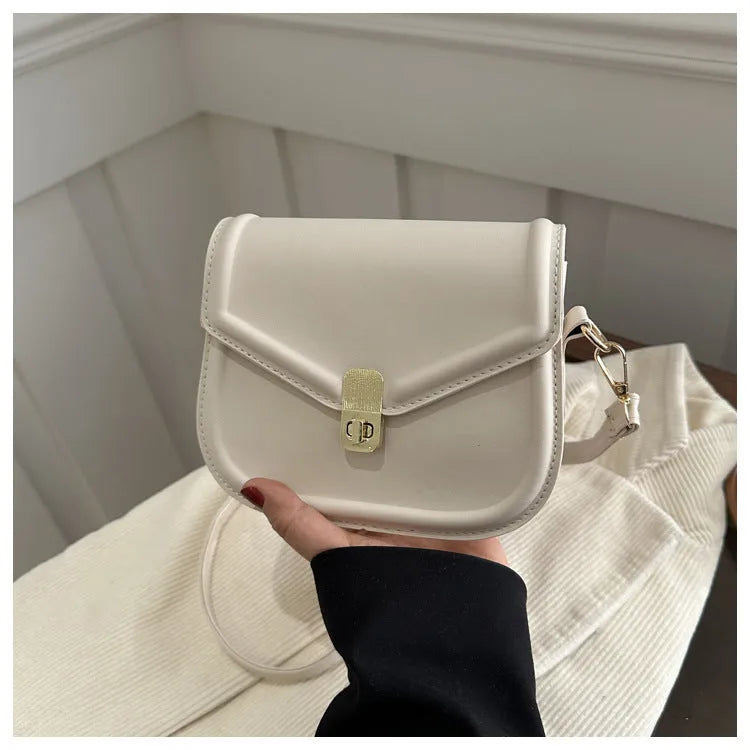 Niche texture shoulder messenger bag in soft PU leather with clamshell opening and horizontal square shape