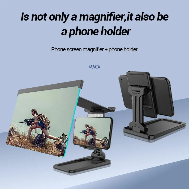 Black folding mobile phone screen magnifier with detachable holder on a desktop.