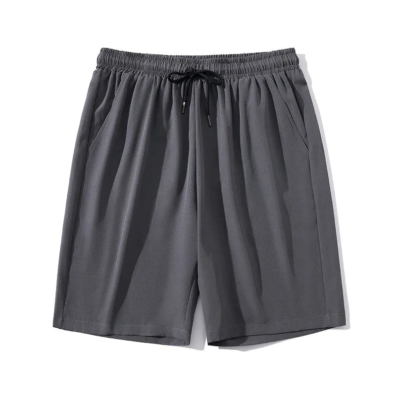 Men's cropped nylon sports trousers in straight cut available in black, blue, gray and khaki
