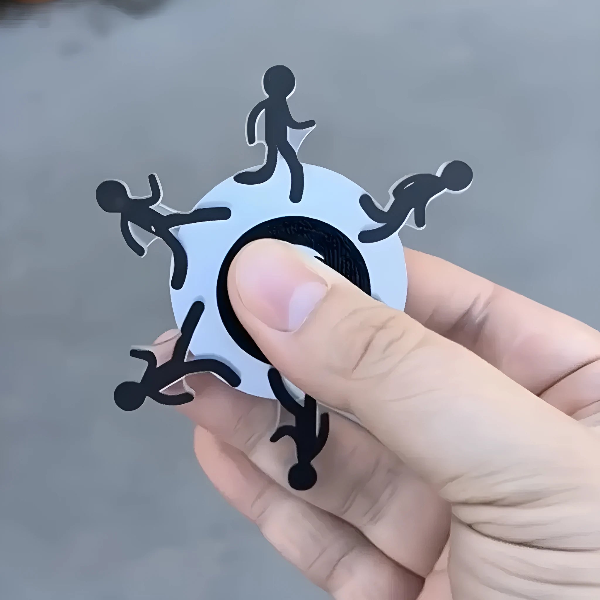 Colourful stickman running dynamic fingertip gyro on a white surface, spinning motion visible