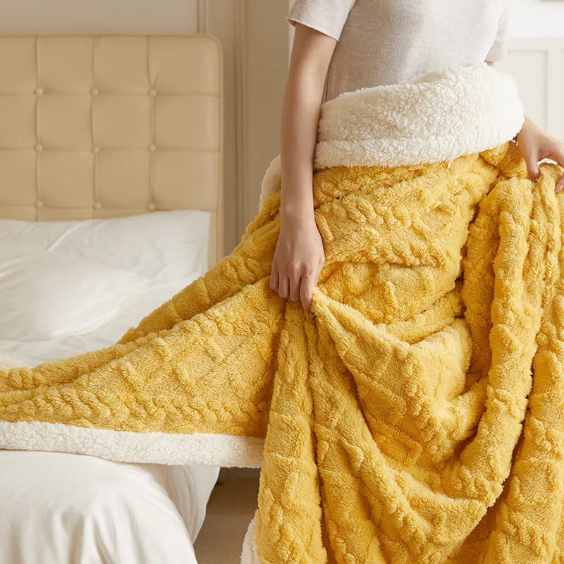 Polyester thermal flannel blanket in beige colour, shown folded to display its thick texture and modern style