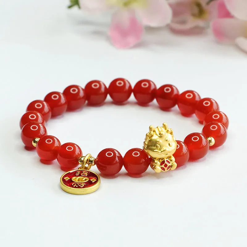 8mm red agate bead bracelet with Dragon charm on black elastic cord.